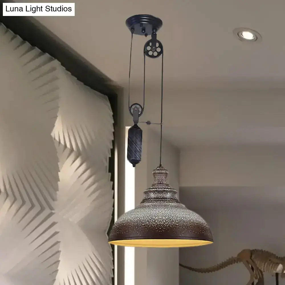 Rustic industrial hammered copper dome pendant light with pulley hanging in living room on Tampa Home & Garden Store