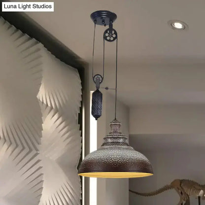 Rustic industrial hammered copper dome pendant light with pulley hanging in living room on Tampa Home & Garden Store