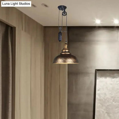 Rustic industrial copper dome pendant light with pulley hanging from ceiling wires on Tampa Home & Garden Store