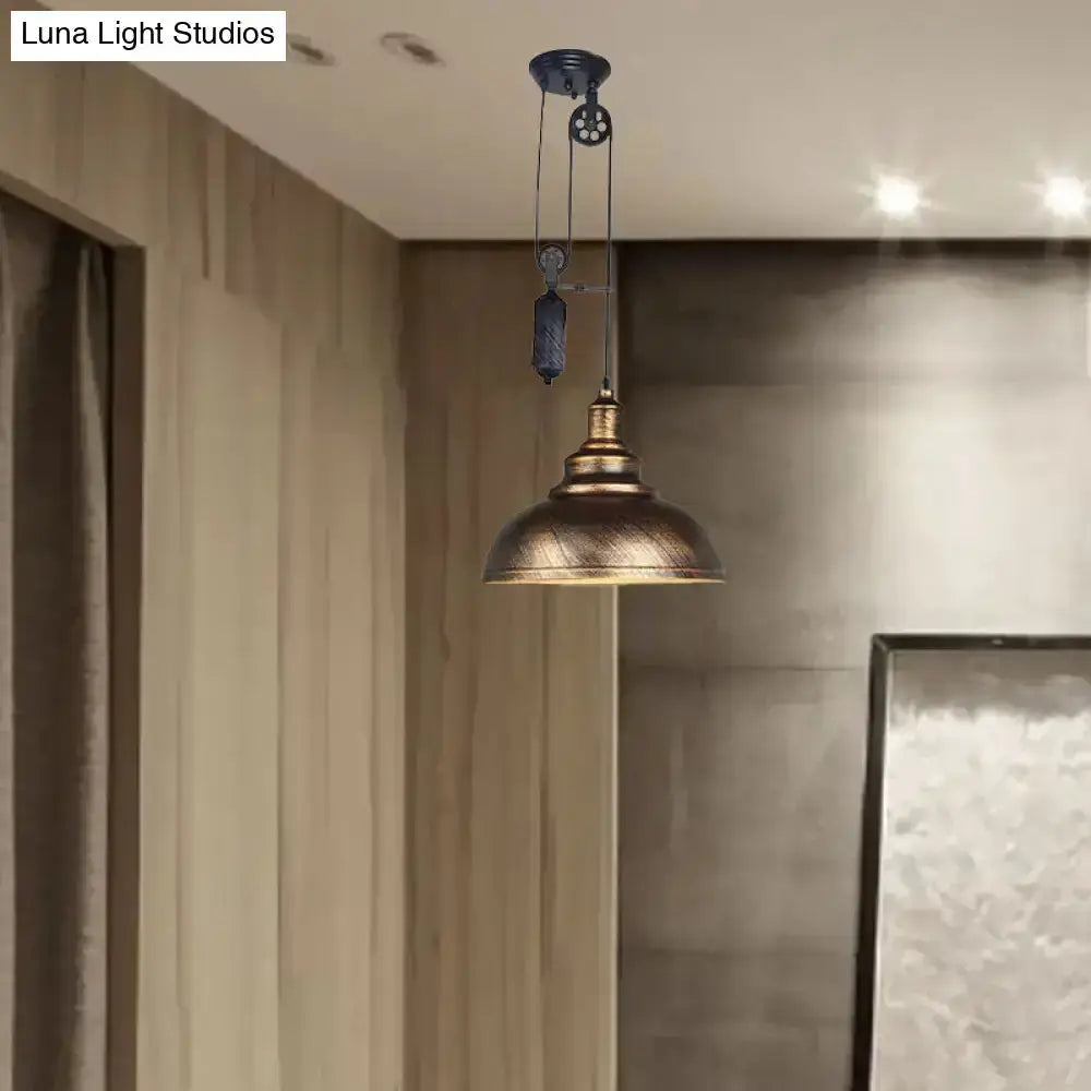 Rustic industrial copper dome pendant light with pulley hanging in a warm-toned living room on Tampa Home & Garden Store