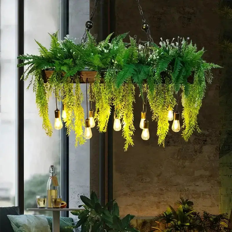 Rustic wood hanging chandelier planter with Edison bulbs and trailing ferns on Tampa Home & Garden Store