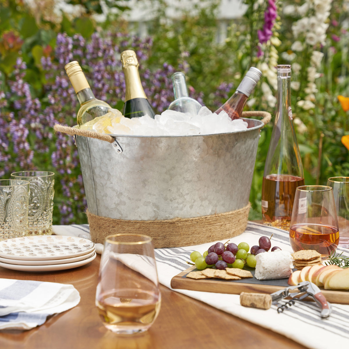 Twine Living ice bucket: galvanized tub wrapped in jute rope with bottles and ice on Tampa Home & Garden Store