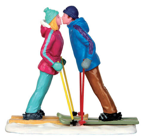 First Ski Date Figurine, kissing couple on skis in winter wear, The Country Christmas Loft on Tampa Home & Garden Store