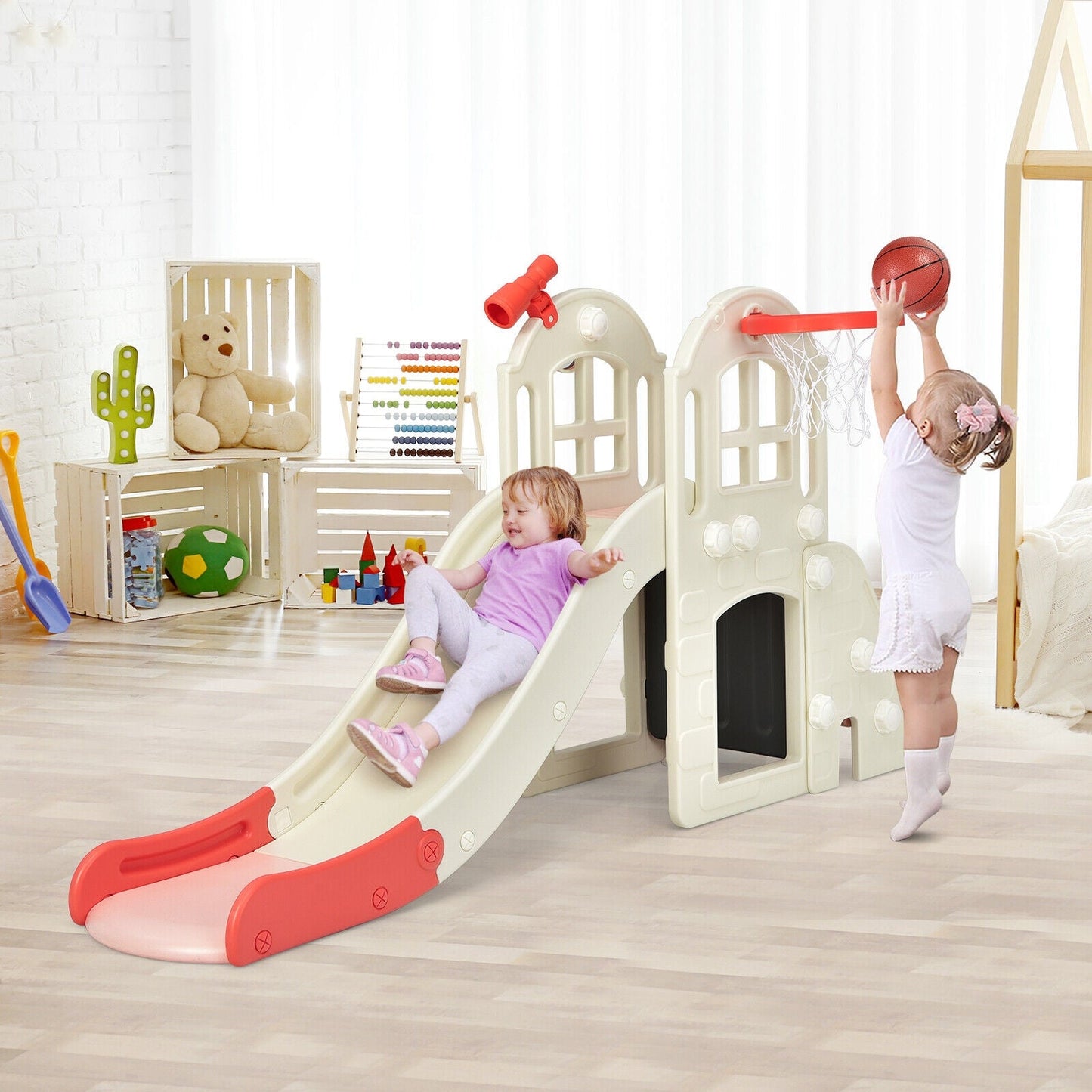 Kids' plastic playset with slide and basketball hoop indoors cream with red accents on Tampa Home & Garden Store