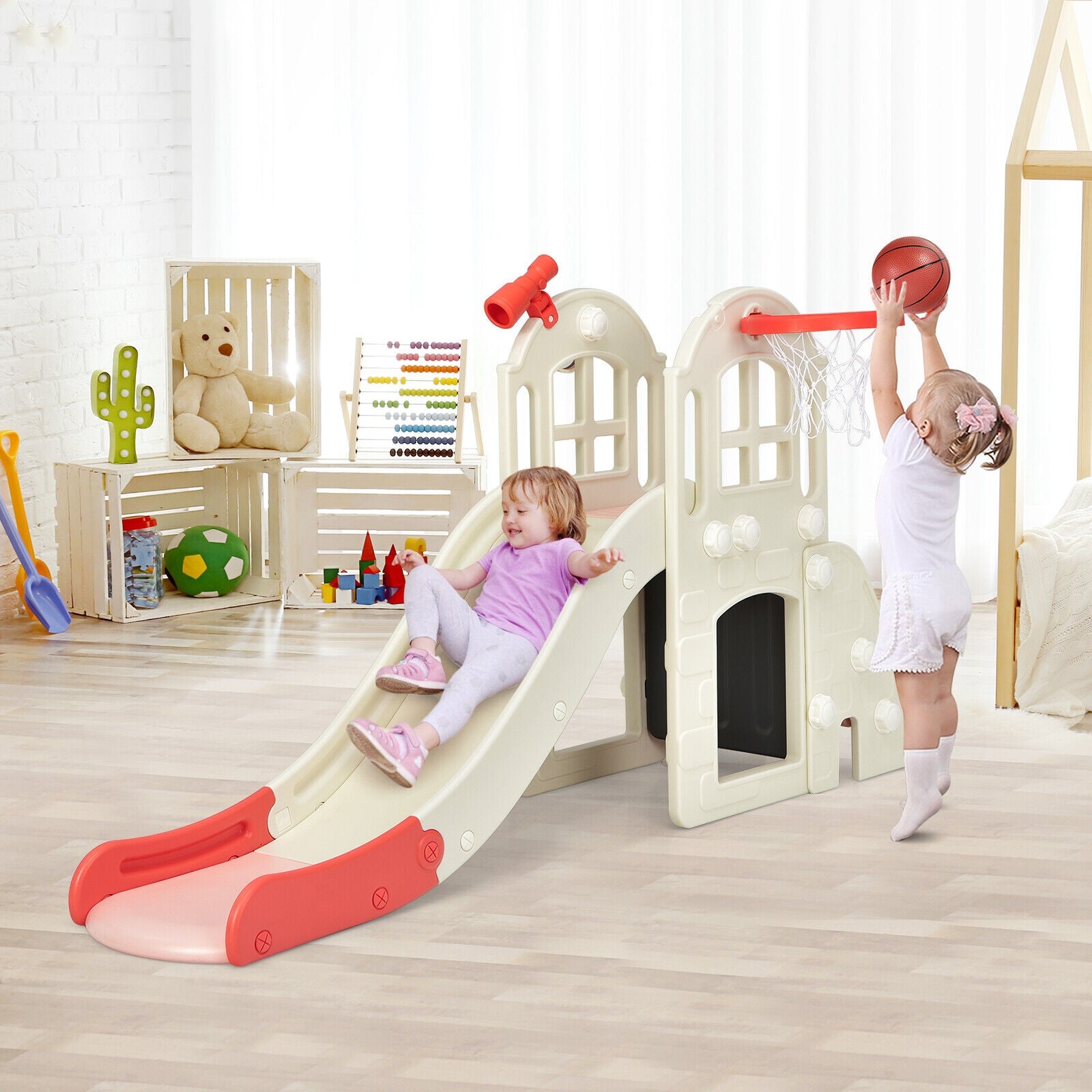 Kids' plastic playset with slide and basketball hoop indoors cream with red accents on Tampa Home & Garden Store