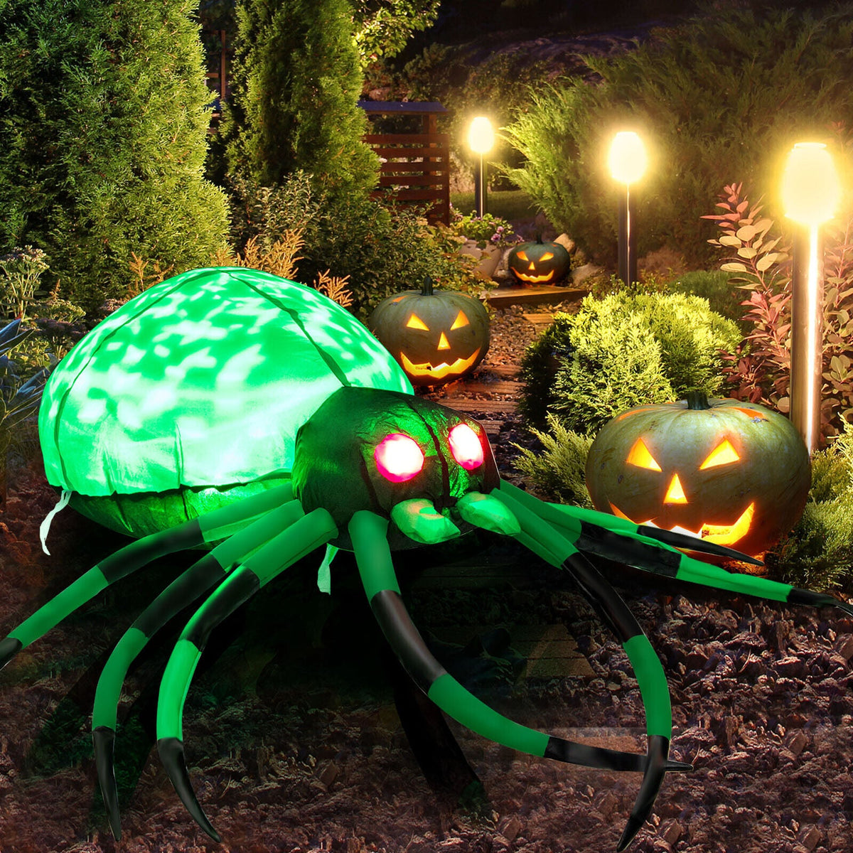 5 ft Halloween inflatable spider with cobwebs and LEDs, green body and long legs among pumpkins on Tampa Home & Garden Store