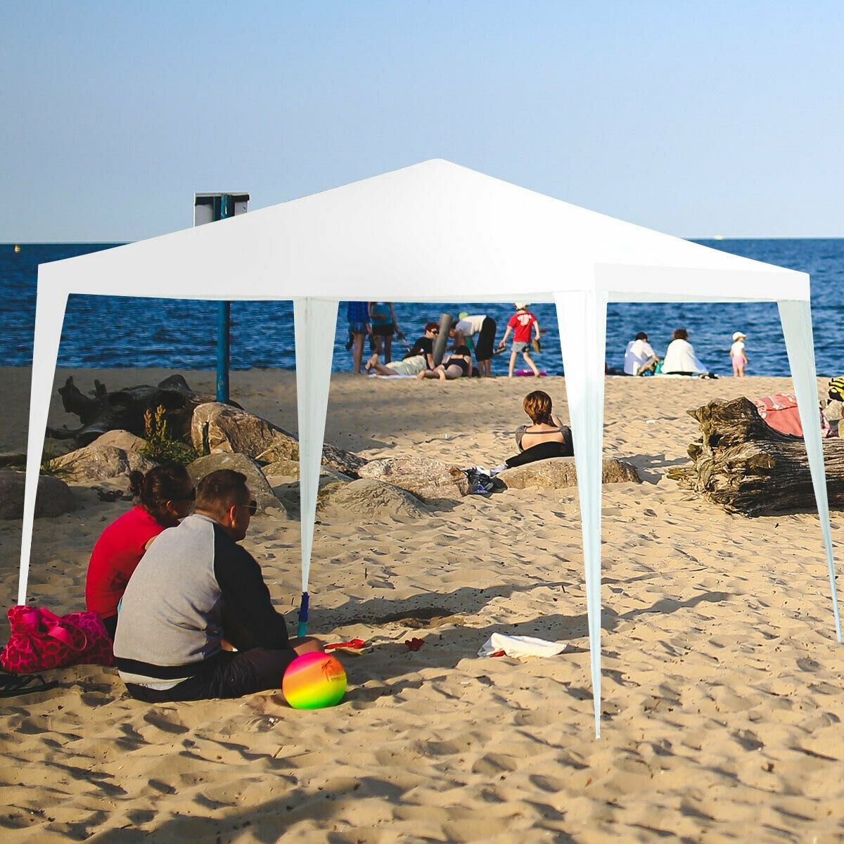 GemGear 10x10 ft outdoor canopy tent with 4 removable sidewalls, white canopy on a sunny beach on Tampa Home & Garden Store