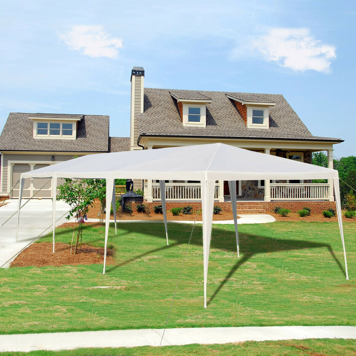 10x30 ft white gazebo canopy tent with stakes and wind ropes in front of a house on Tampa Home & Garden Store
