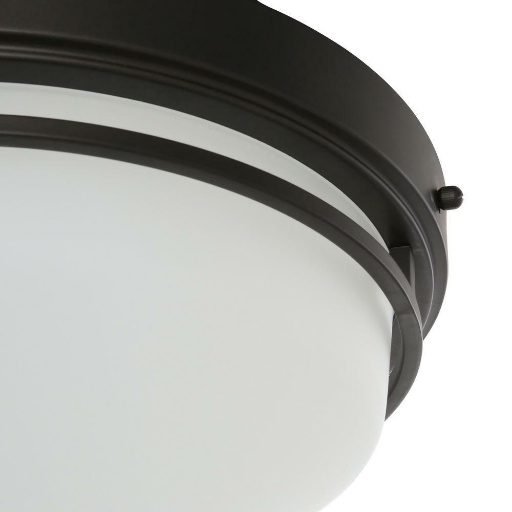 World Imports oil rubbed bronze LED flushmount with frosted glass, 13.25 in diameter on Tampa Home & Garden Store