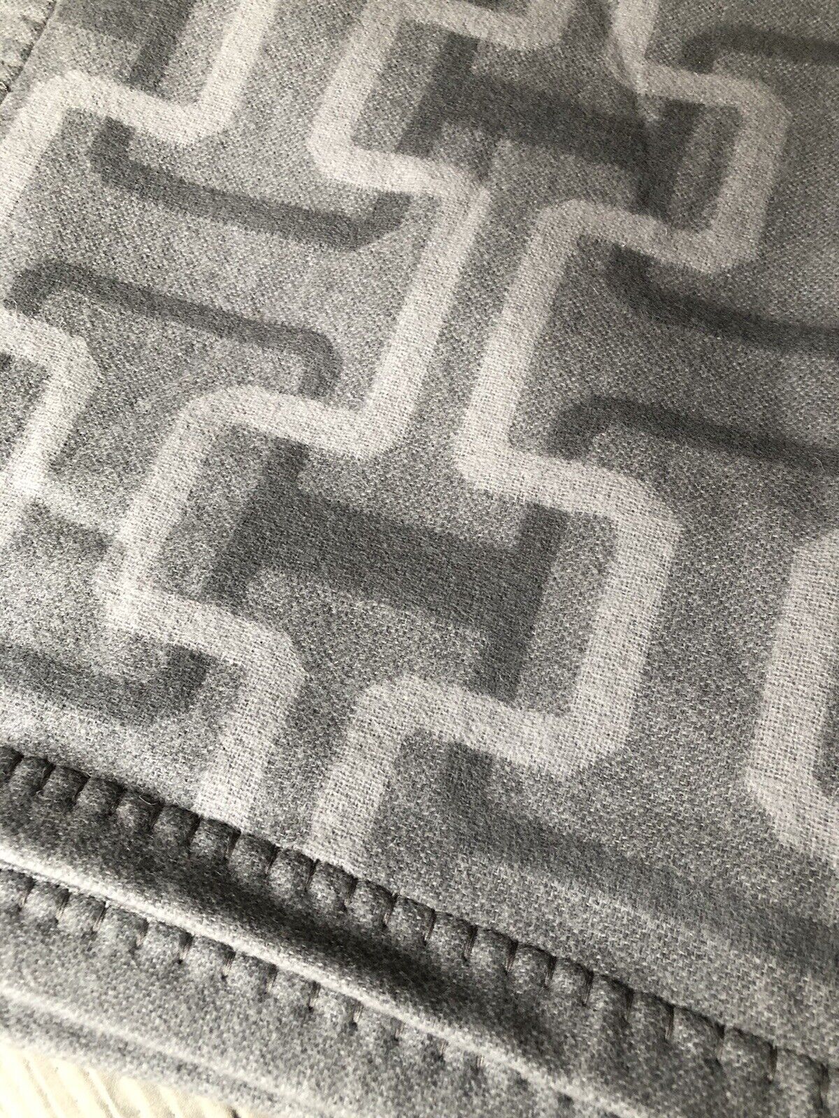 Hudson Park Collection lambswool/cashmere jacquard throw in grey with stitched border on Tampa Home & Garden Store
