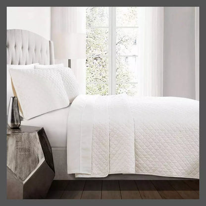 Lush Decor Ava Diamond oversized cotton 3-piece quilt set Full/Queen with white shams on bed on Tampa Home & Garden Store