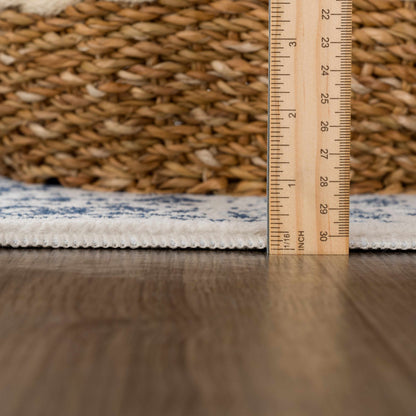 Michie Blue Area Rug Boutique Rugs blue woven rug with cream fringe and ruler for scale on Tampa Home & Garden Store