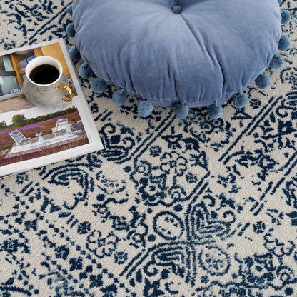 Michie Blue Area Rug by Boutique Rugs, navy ivory geometric pattern, plush tufted texture on Tampa Home & Garden Store