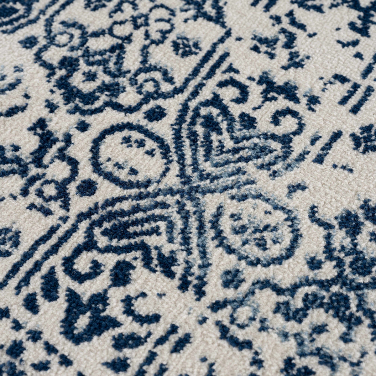 Michie Blue Area Rug by Boutique Rugs with blue ivory ornate pattern on Tampa Home & Garden Store