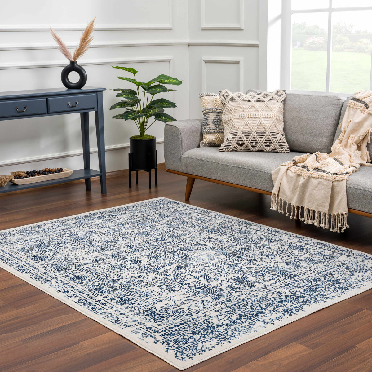 Michie Blue Area Rug by Boutique Rugs with ivory background and blue pattern on Tampa Home & Garden Store