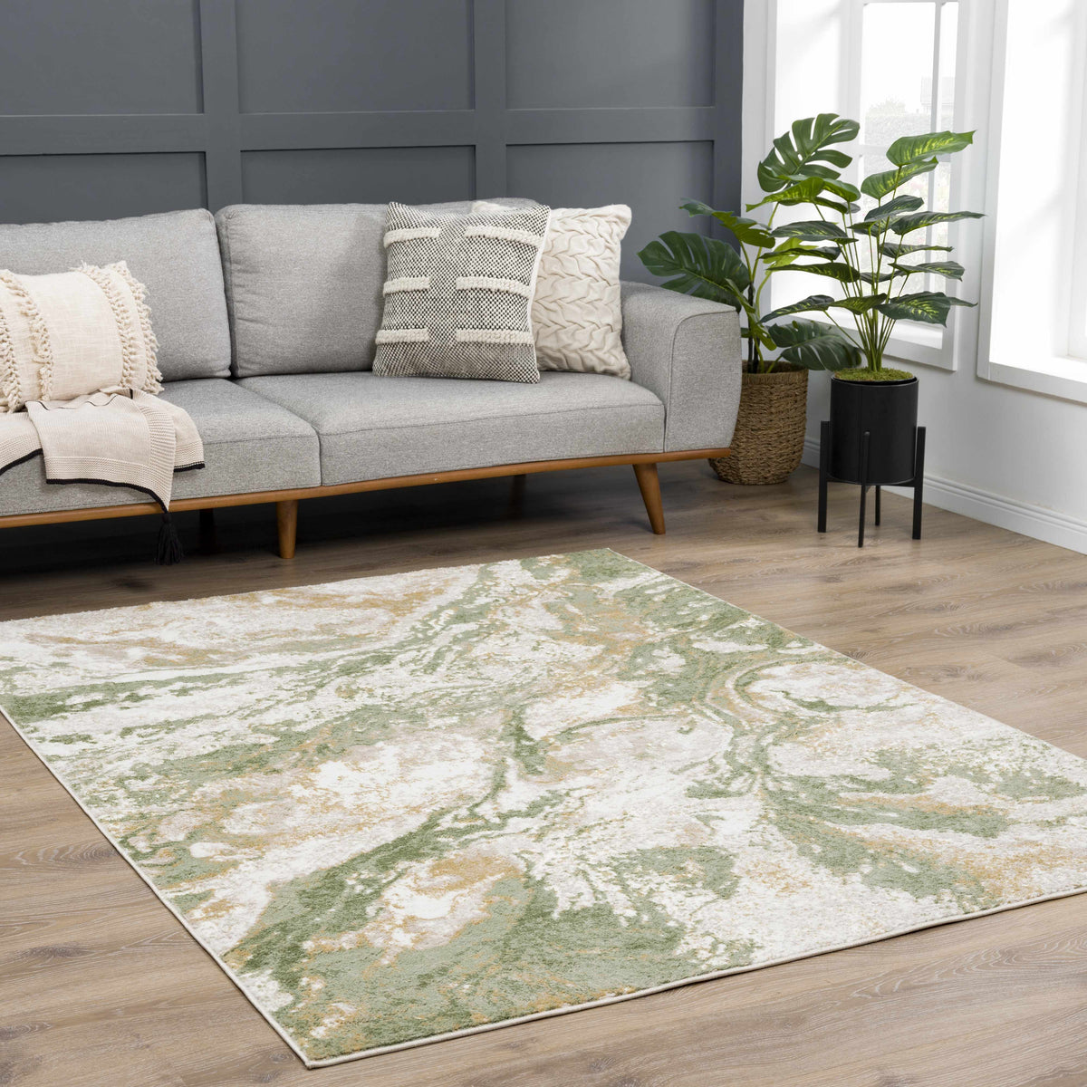 Lively Marble Green Area Rug by Boutique Rugs with green marble pattern beside gray sofa on Tampa Home & Garden Store