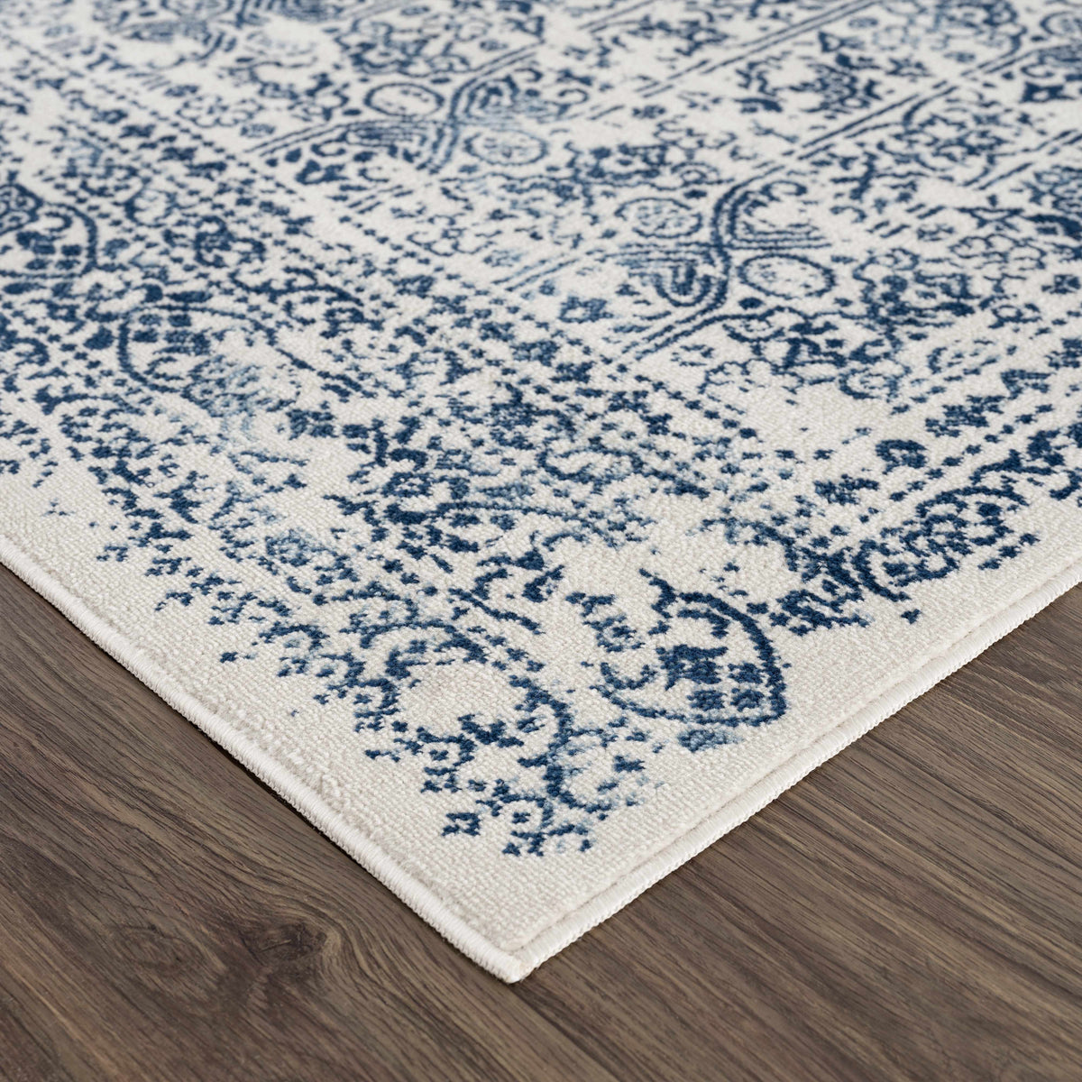 Michie Blue Area Rug by Boutique Rugs in blue and ivory Persian-inspired pattern on Tampa Home & Garden Store