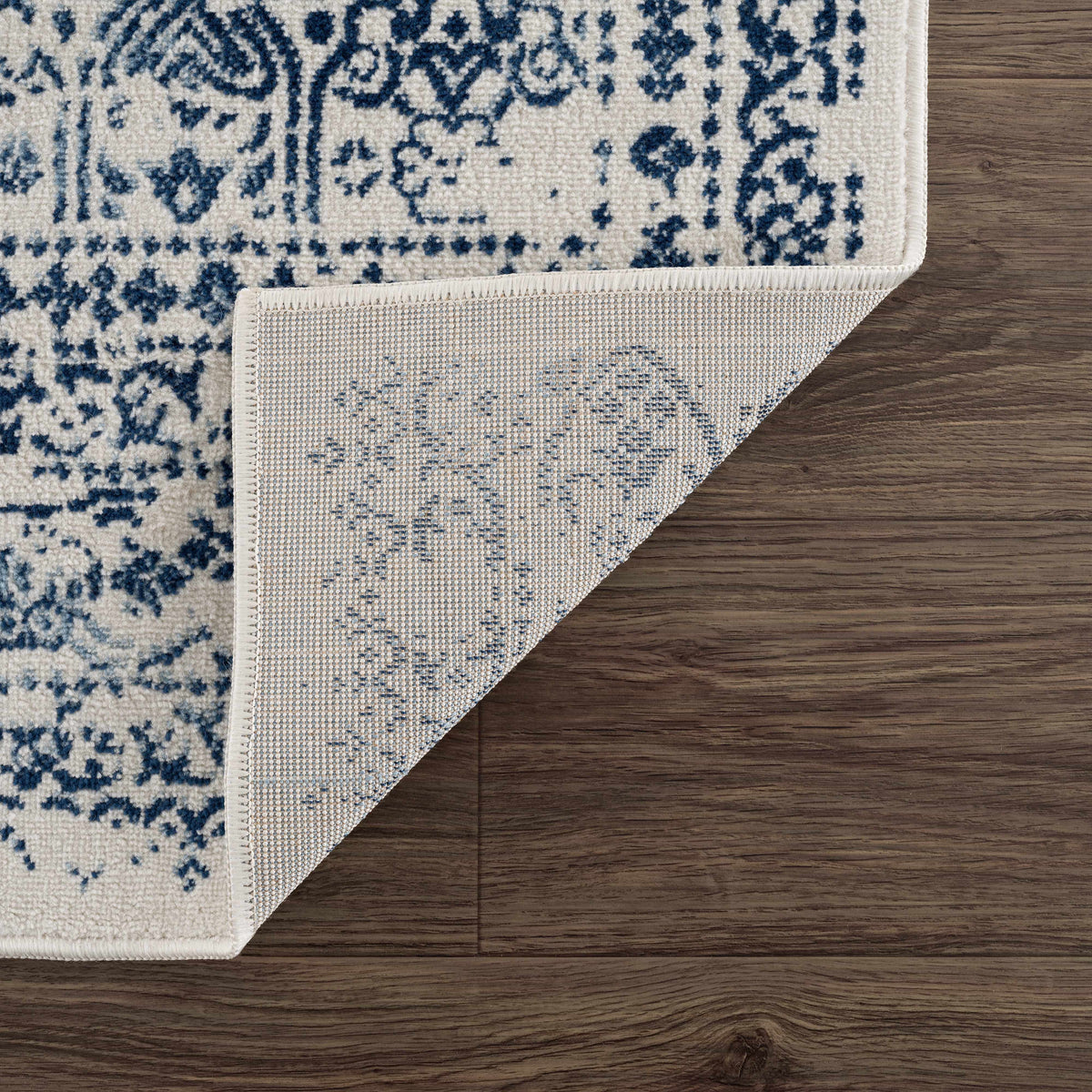 Michie Blue Area Rug by Boutique Rugs, blue ornate pattern on cream field on Tampa Home & Garden Store