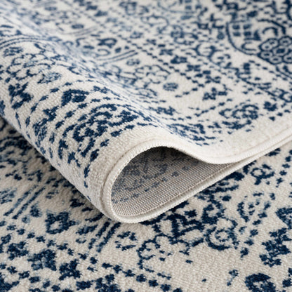 Michie Blue Area Rug by Boutique Rugs closeup of blue ivory patterned textile on Tampa Home & Garden Store