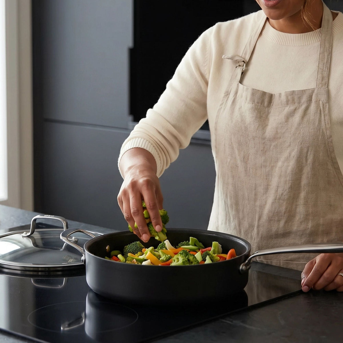 Ceramic Nonstick Sauté Pan with Lid 4-Qt by Alva Cookware on stove with vegetables on Tampa Home & Garden Store
