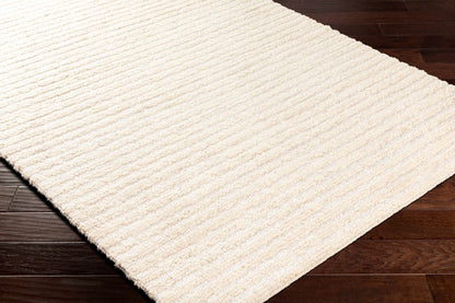 Debra area rug cream textured loop pile on dark hardwood floor on Tampa Home & Garden Store