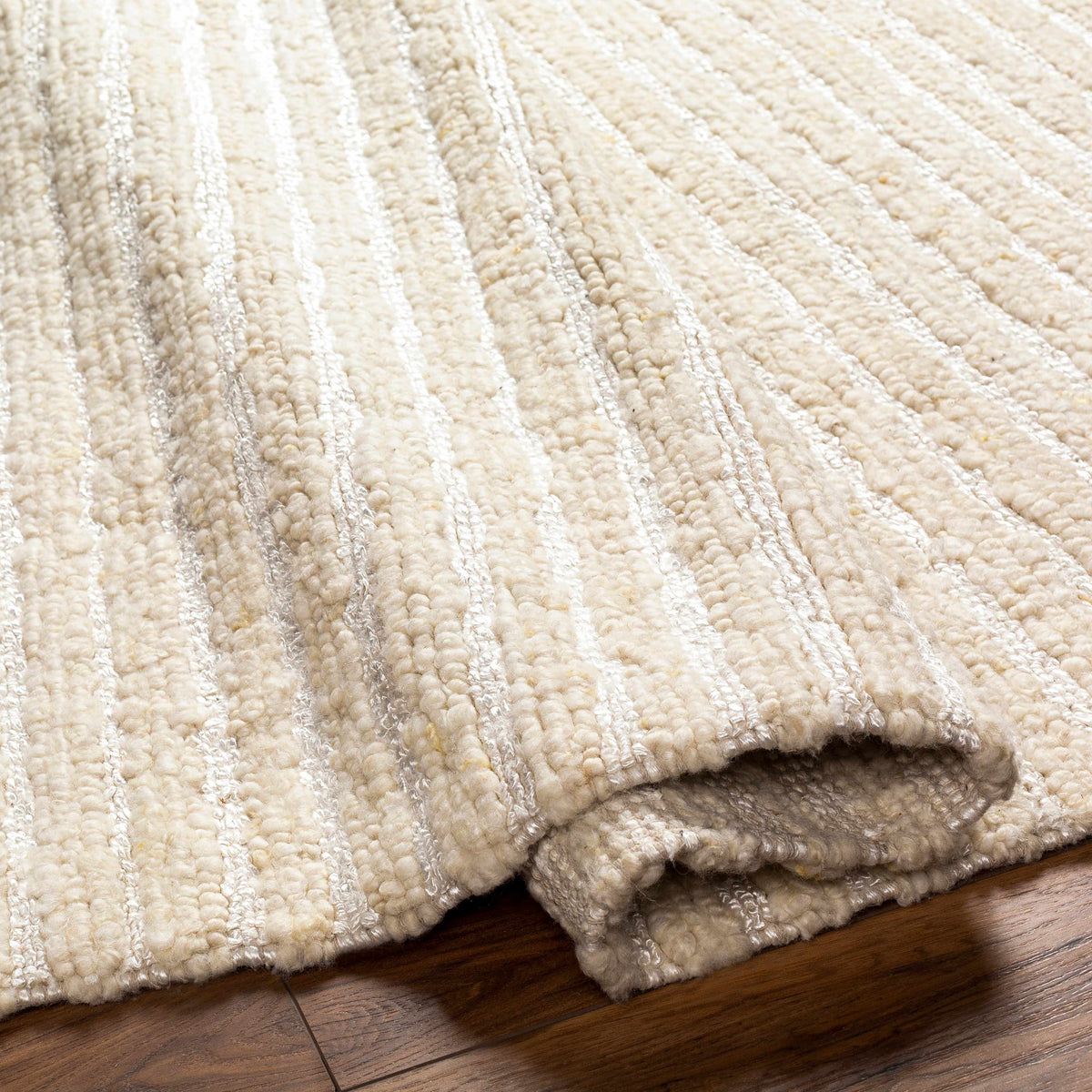 Debra Area Rug cream shag with silver stripe pattern thick plush pile on wood floor on Tampa Home & Garden Store