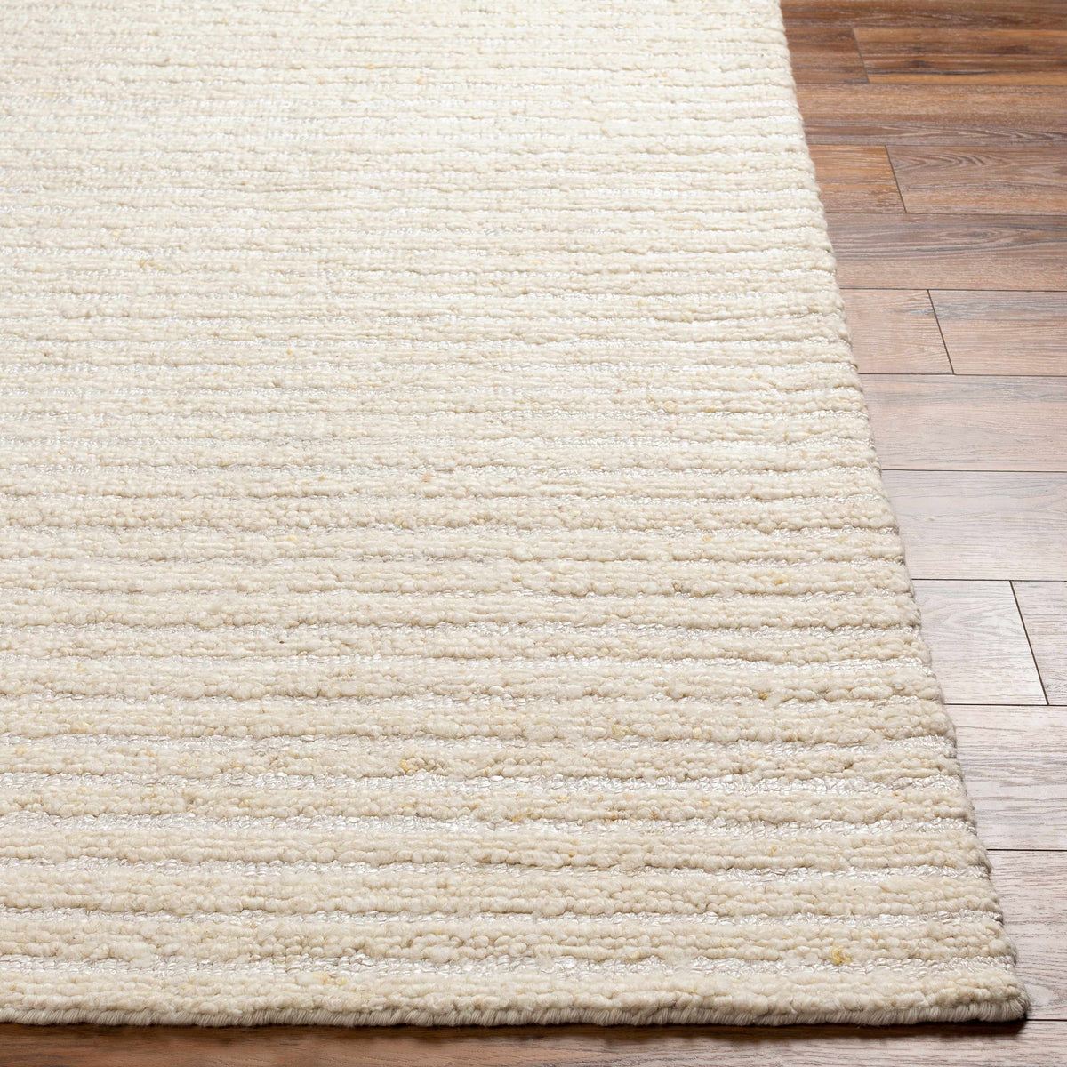 Debra Area Rug by Boutique Rugs, cream plush shag pile on wood floor on Tampa Home & Garden Store