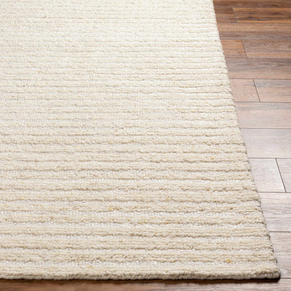 Debra Area Rug by Boutique Rugs, cream plush shag pile on wood floor on Tampa Home & Garden Store