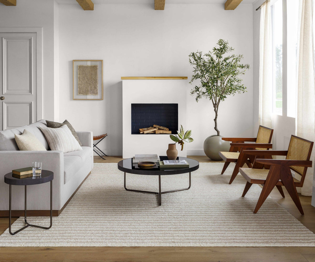 Saku Cream Striped Wool Rug by Boutique Rugs in a bright living room on Tampa Home & Garden Store