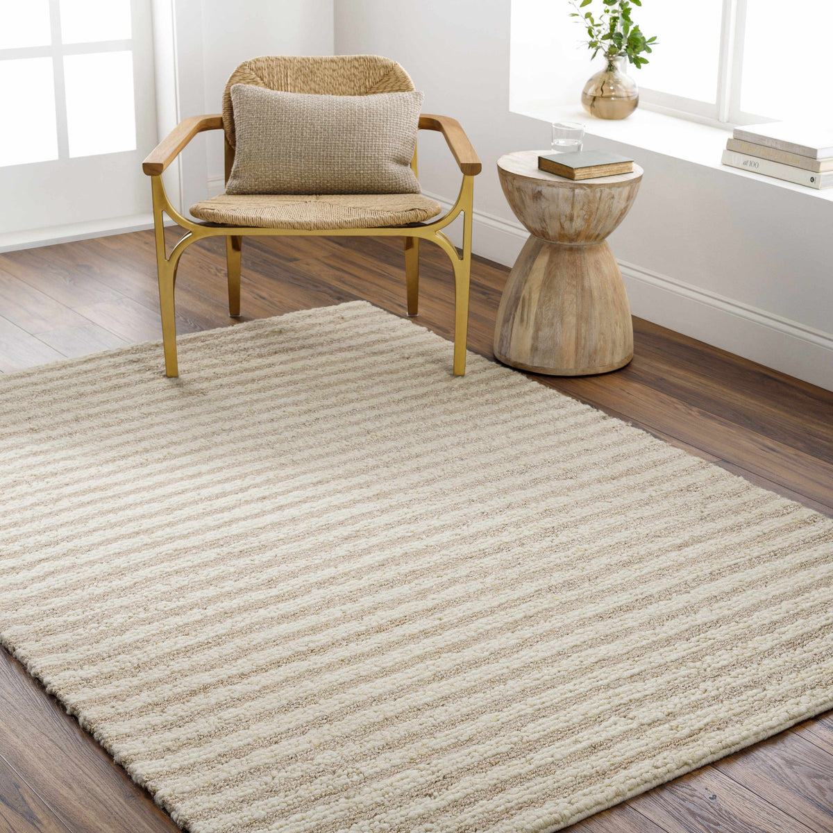 Saku Cream Striped Wool Rug by Boutique Rugs, cream wool with subtle stripes on hardwood floor on Tampa Home & Garden Store