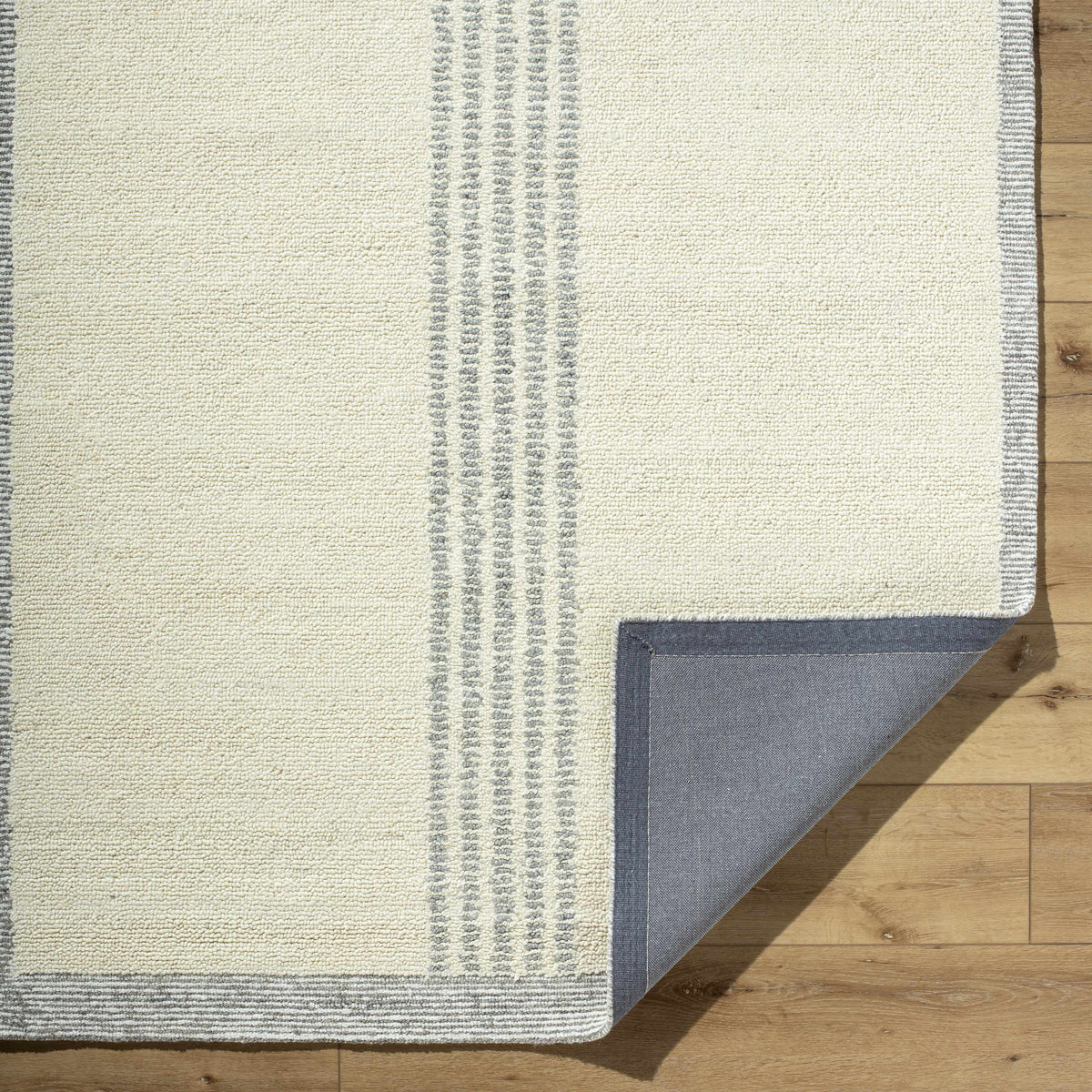 Ande Cream Area Rug by Boutique Rugs, cream woven rug with grey vertical stripe accents on Tampa Home & Garden Store