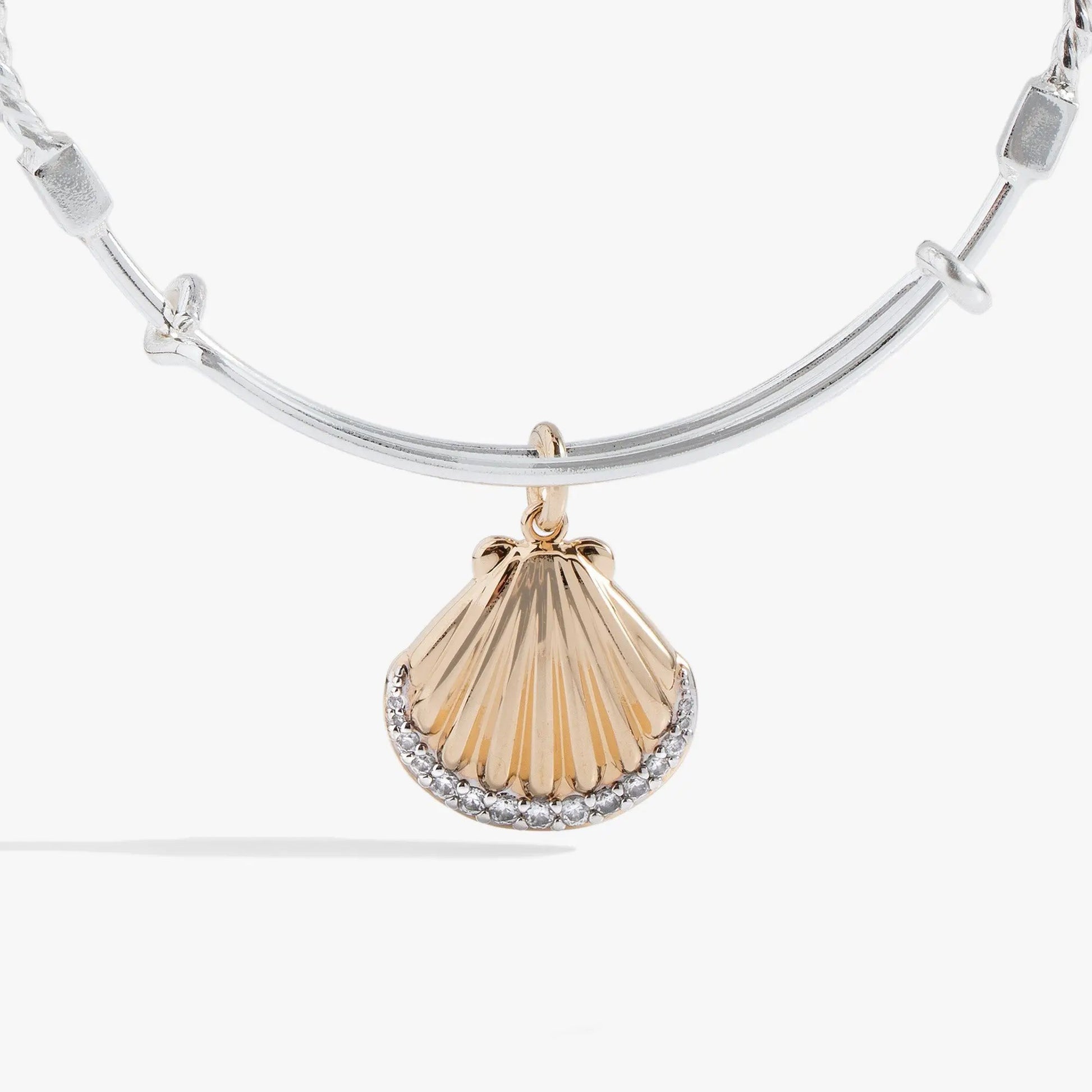 Textured scallop seashell charm bracelet with a gold-toned shell pendant on a silver bangle on Tampa Home & Garden Store