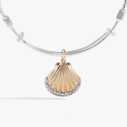 Textured scallop seashell charm bracelet with a gold-toned shell pendant on a silver bangle on Tampa Home & Garden Store