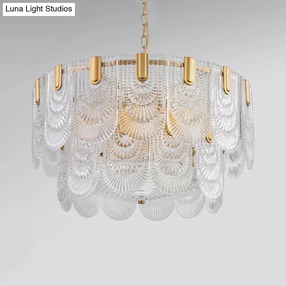 Textured Glass Brass Chandelier with gold hardware and cascading clear disc panels on Tampa Home & Garden Store