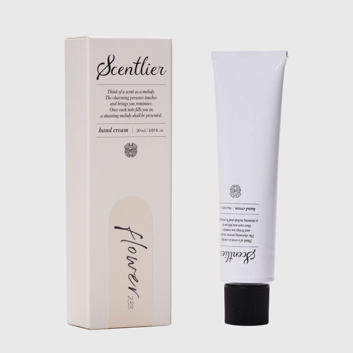 White hand cream tube and beige box for Scentlier Hand Cream 50ml by Seoulia, floral label on Tampa Home & Garden Store