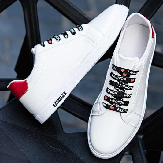 Mens Stevvex white leather sneakers pair with black fashion laces and red heel tab on Tampa Home & Garden Store