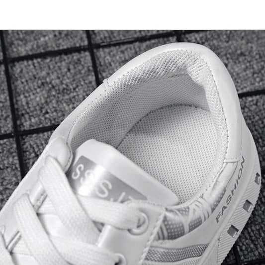 White lace-up low-top sneakers with mesh lining and side fashion text on Tampa Home & Garden Store
