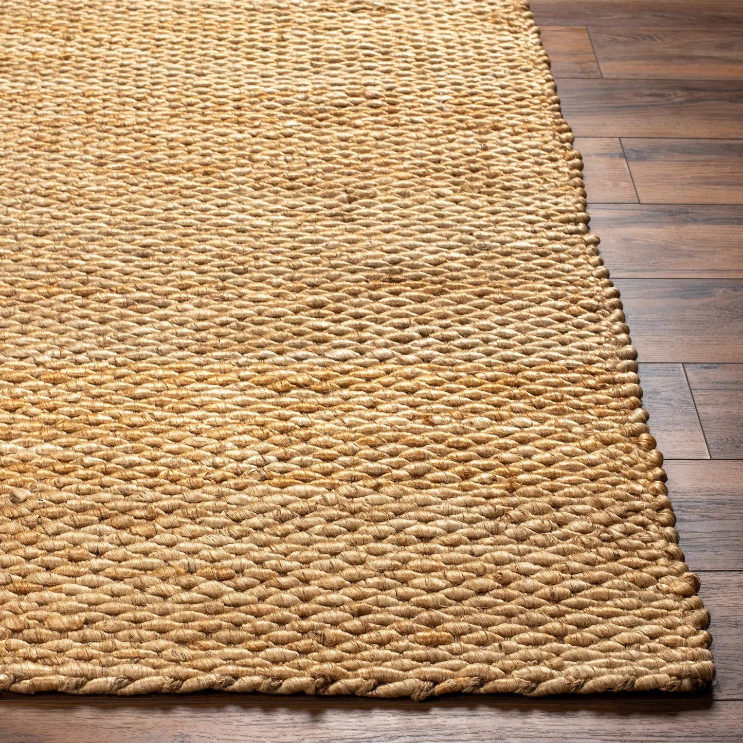 Olof Hand Woven Jute Rug natural tan textured weave on wood floor on Tampa Home & Garden Store