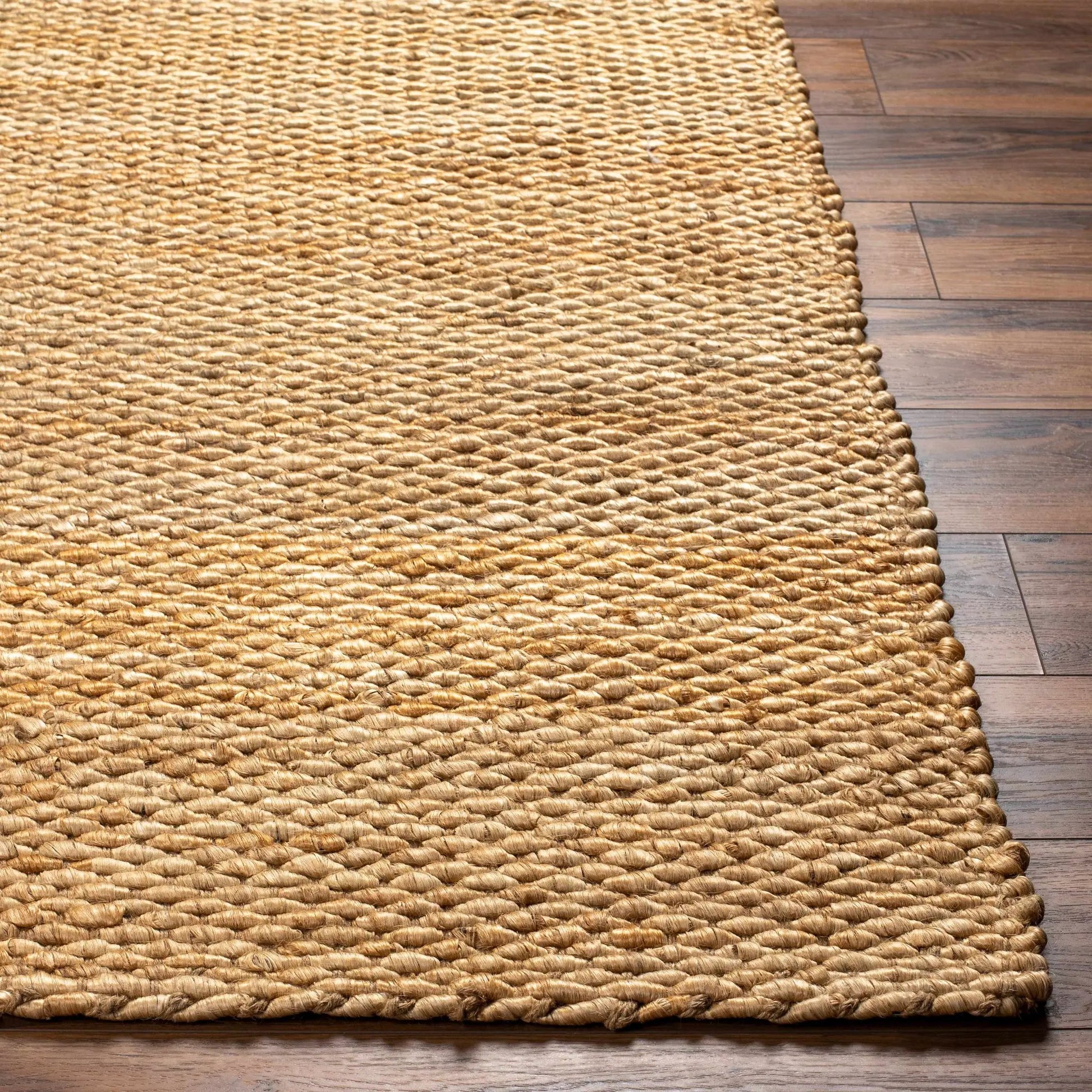 Olof Hand Woven Jute Rug natural tan textured weave on wood floor on Tampa Home & Garden Store