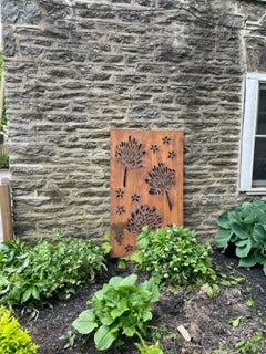 Metal privacy screen wall art with floral cutouts in rust finish, 46-inch outdoor decor on Tampa Home & Garden Store
