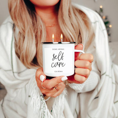 16oz candle mug Gia Roma, enamel mug with black rim and self care label, two lit wicks on Tampa Home & Garden Store
