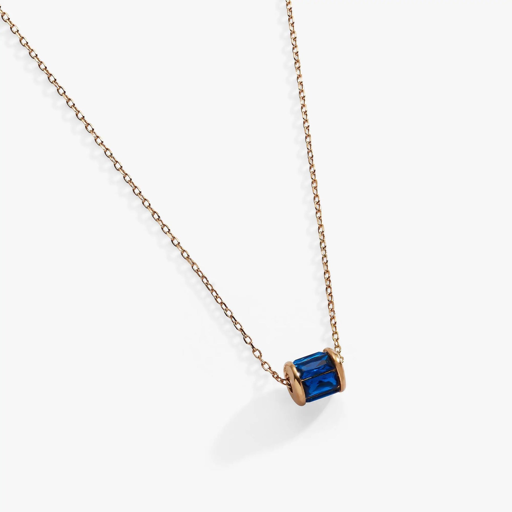 September Birthstone Pendant Necklace blue gemstone in gold-tone bezel on rose-gold chain on Tampa Home & Garden Store