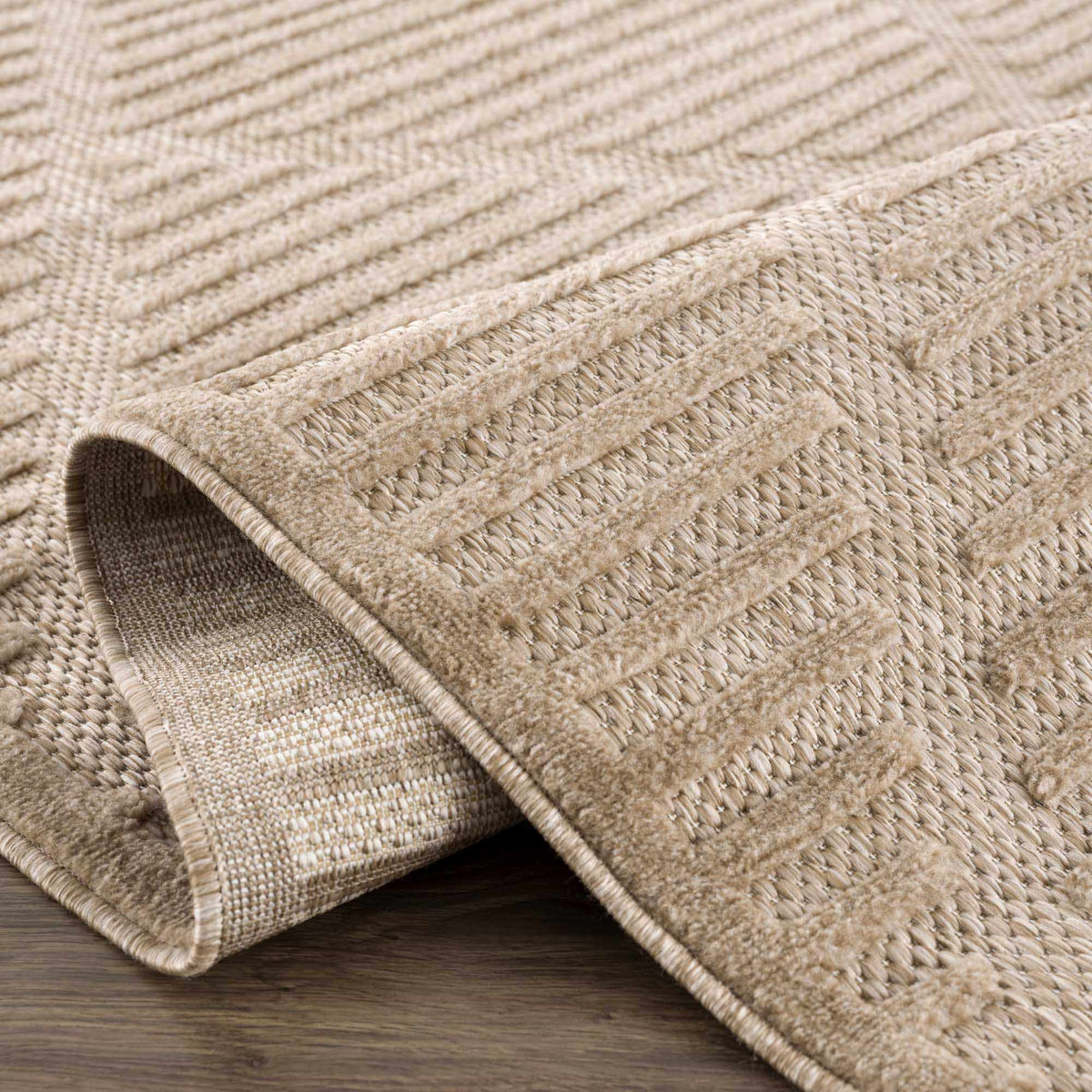 Anah Tan outdoor rug by Boutique Rugs, beige natural jute weave, rolled edge on Tampa Home & Garden Store