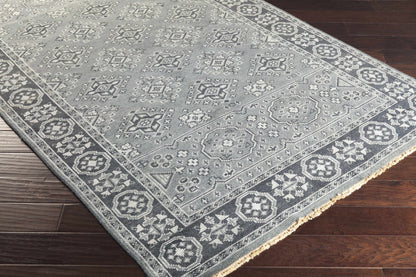Sherwood Area Rug in cool gray with ivory geometric medallions and a fringed edge on Tampa Home & Garden Store
