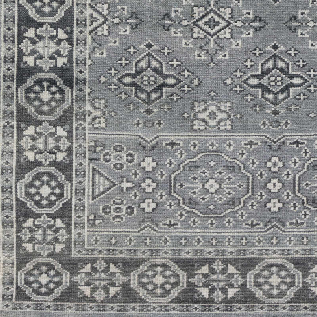 Sherwood Area Rug by Boutique Rugs, gray-blue geometric medallion pattern with border on Tampa Home & Garden Store