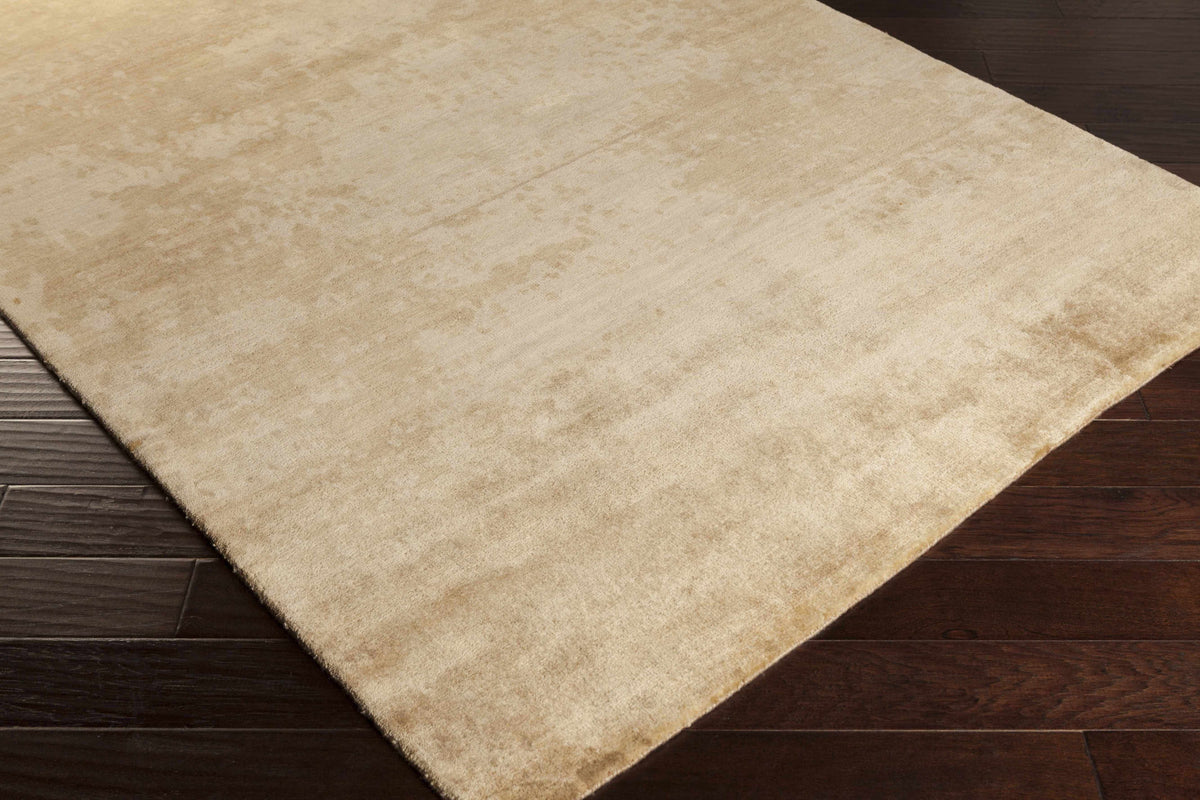 Shushan Area Carpet beige area rug on dark wood floor on Tampa Home & Garden Store