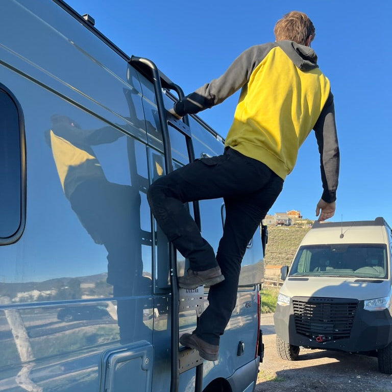 Mercedes Sprinter van side ladder by Avatar Offroad, black metal ladder attached to the van on Tampa Home & Garden Store