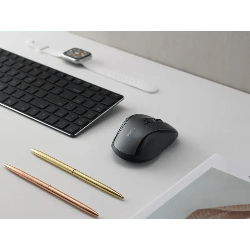 Stevvex black wireless mouse with DPI switch beside a keyboard on a clean desk on Tampa Home & Garden Store