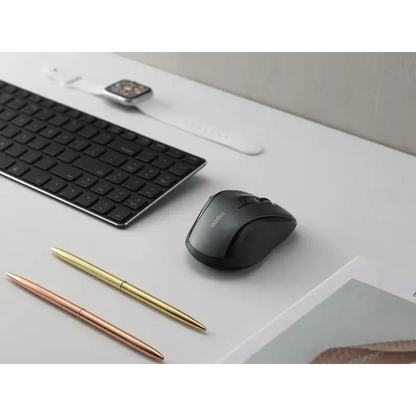 Stevvex black wireless mouse with DPI switch beside a keyboard on a clean desk on Tampa Home & Garden Store