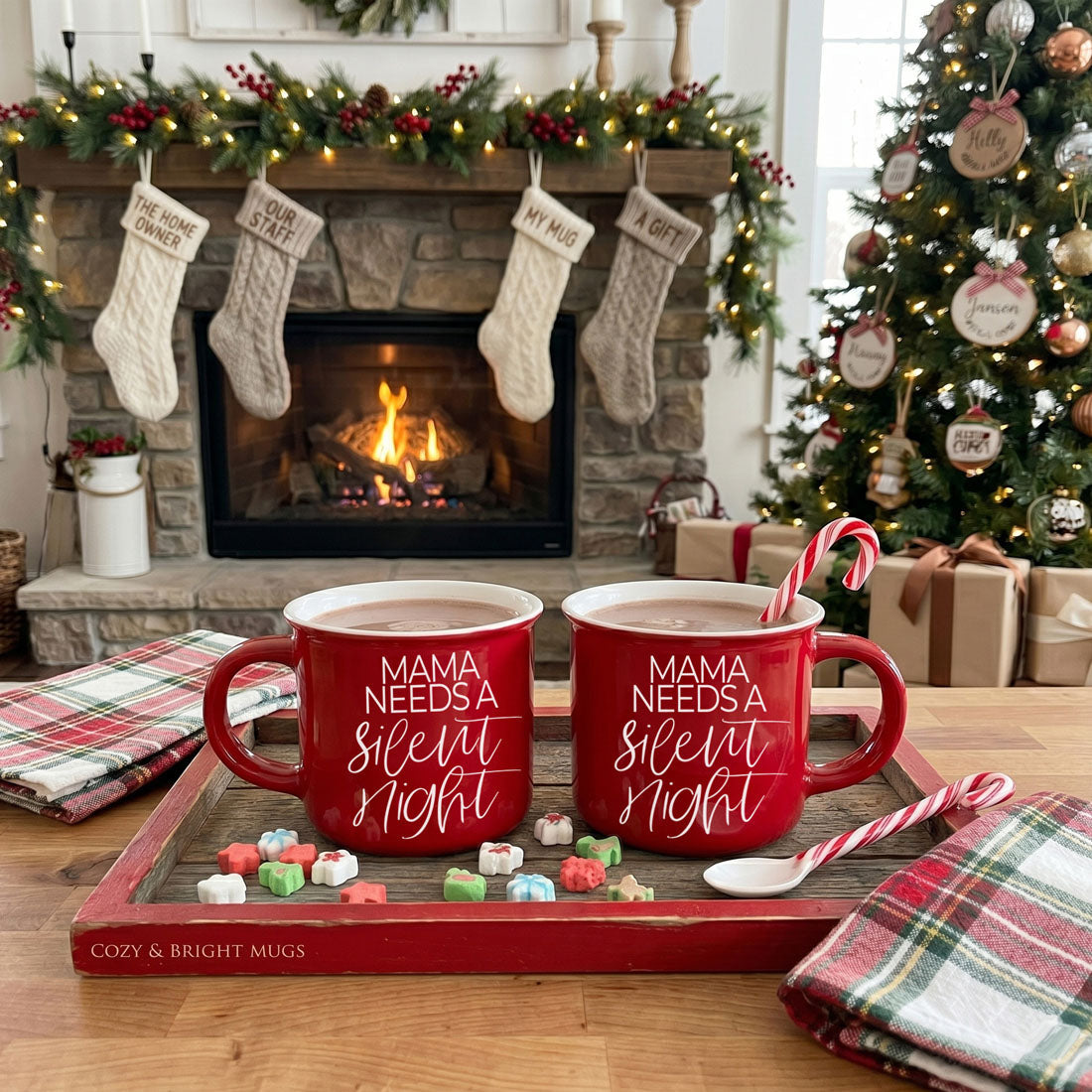 Two red Gia Roma Mama Needs A Silent Night mugs on a tray with candy canes, festive fireplace on Tampa Home & Garden Store